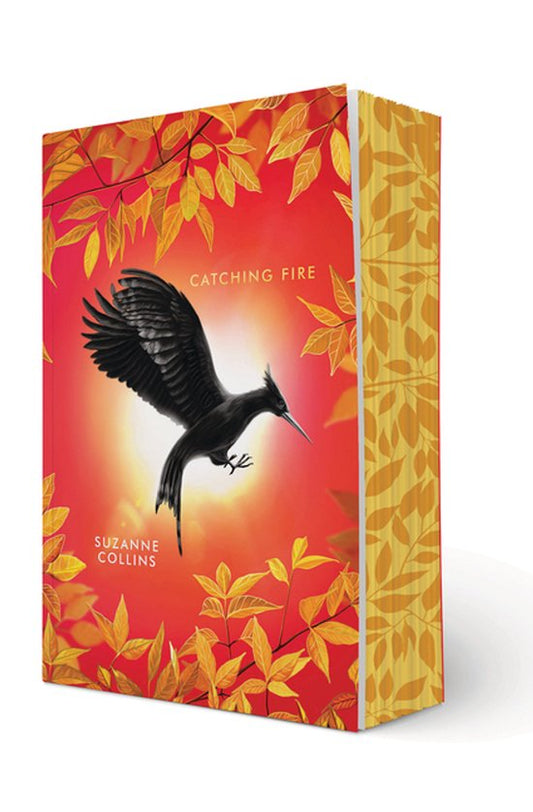 Boekcover van Catching Fire Deluxe Edition – Suzanne Collins
